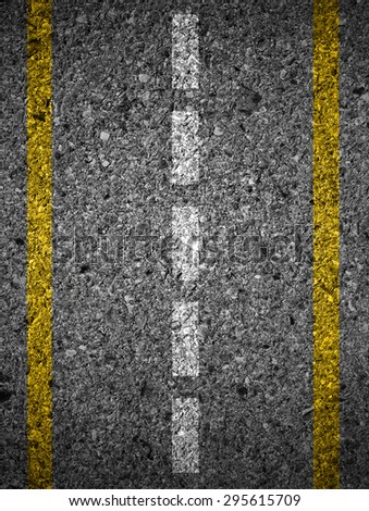 Road texture with two yellow and dashed white stripe