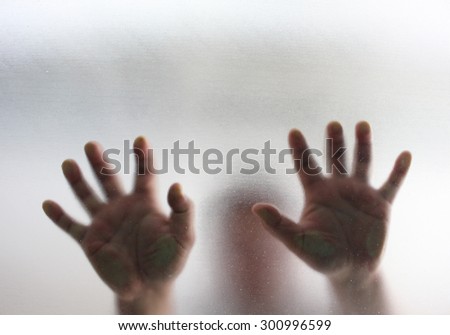 Human finger on glass background