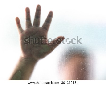 Human finger on glass background