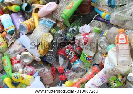 ROI ET, THAILAND - AUGUST 1, 2015: Plastic bottles and beverage cans on a recycle factory in Roi Et, Thailand. The plastic can will be sorted for recycling.