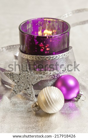 purple and silver storm lamps with Christmas balls