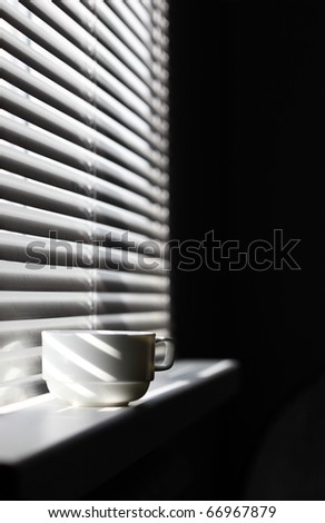 Coffee mug on a window sill