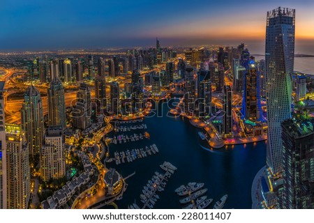 DUBAI, UAE - OCTOBER 13: Modern buildings in Dubai Marina, Dubai, UAE. In the city of artificial channel length of 3 kilometers along the Persian Gulf, taken on 13 October 2014 in Dubai.
