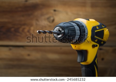 electric drill on a wooden background