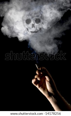 Hand holding cigarette with skull in smoke indicating danger by smoking!