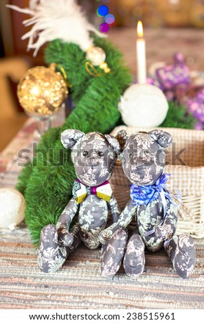 Couple handmade provence gray tilda bear toys on christmas background. Celebration gift. Indoors still-life.