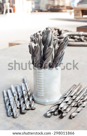 Many metal drill bits. Drilling and milling industry. Closeup.