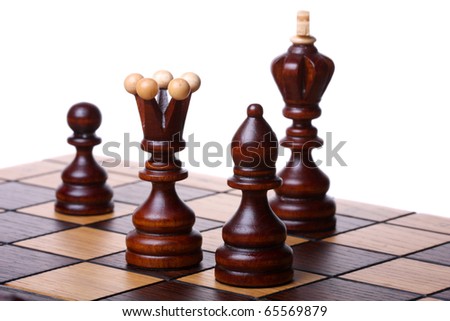 Wooden chess pieces on a chess board. Isolated on white, shallow DOF
