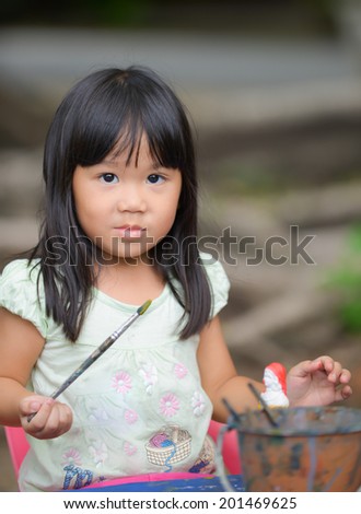 Cute Asian girl prefer to painting color