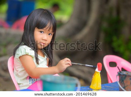 Cute Asian girl prefer to painting color