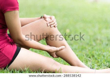 Leg Pain In A Woman on green background