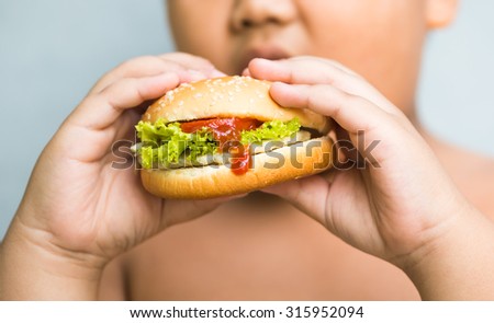 chicken cheese Hamburger in obese fat boy hand