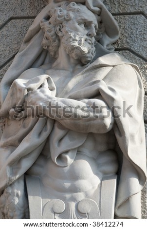 a sculptured man holding a towel with his hand
