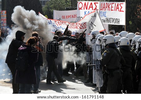 ATHENS, GREECE -FEB. 02: Violent clashes with use of tear gas, between the riot police and unemployed protesters in Athens Syntagma Square, February 07, 2010.