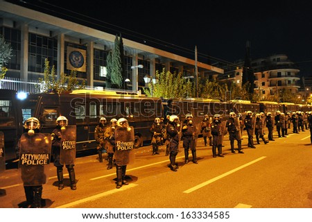 ATHENS, -NOV. 17. Riot police officers protect the Embassy of the United States, during a protest commemorating the student uprising against a military dictatorship in 1973, in Athens, Nov. 17, 2013.