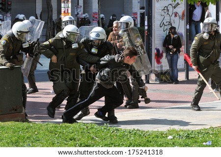ATHENS, GREECE-March 11 Riot police arresting demonstrator, in central Athens, March 11, 2010.