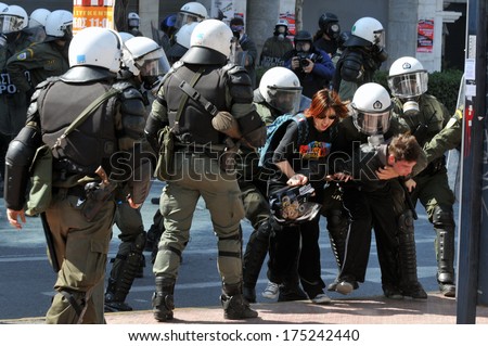 ATHENS, GREECE-March 11. Riot police arresting demonstrator, in central Athens, March 11, 2010.