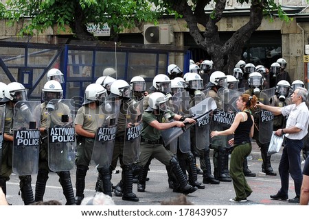 ATHENS, GREECE JUNE 15. Greek economic crisis. Riot police in front of the Greek parliament stop the protestors, during demonstration in Athens, June 15, 2011.