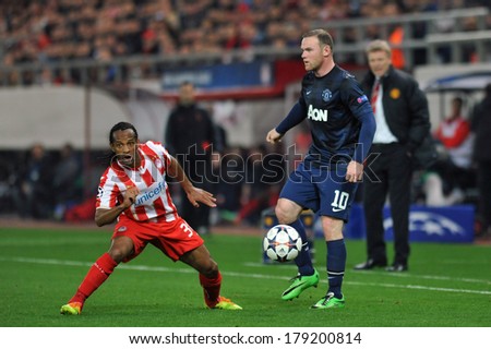 PIRAEUS, GREECE -FEB. 25. Wayne Rooney of Manchester United (R) and Leandro Salino (L) during the match between Olympiacos FC and Manchester United (2-0) at Karaiskakis Stadium on February 25, 2014