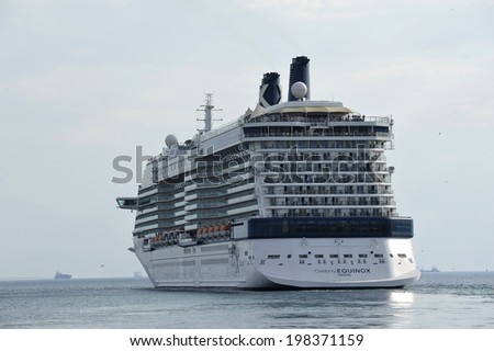 PIRAEUS, GREECE -June, 8 2014 Celebrity Equinox owned and operated by Celebrity Cruises, departing port of Piraeus. Ship built: 2008. Length 317,2 m (1041 ft) Decks 19.  Passengers: 2,850 Crew: 1,250