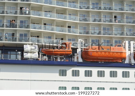 PIRAEUS, GREECE -June 10, 2014.  Safety lifeboats and passengers cabins of cruise ship Celebrity Reflection. Ship was built in 2012 with length 319m and has capacity of 3046 passengers.