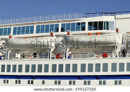 PIRAEUS, GREECE -MAY 27, 2014.  Safety lifeboats and passengers cabins of cruise ship Golden Iris Ship was built in 1975 and has a capacity of 959 passengers and 350 crew.