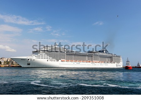 Piraeus, Greece - July, 24, 2014: Msc Fantasia is a cruise ship of Msc Cruises. Has built in 2008,Tonnage 137,936 GT, Length 333.3 m, Passengers 3,900 and Crew 1,313