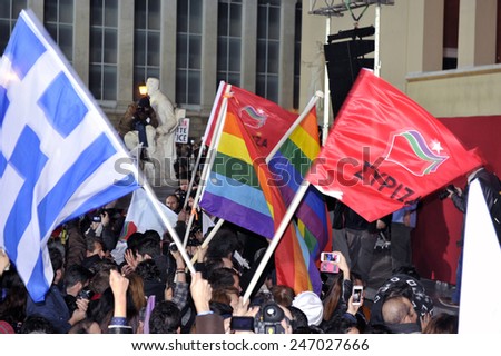Athens, Greece Jan. 25, 2015 Supporters of Syriza left wing party with flags of Greece , Syriza`s party and the flag of gay movement outside Athens University.. Syriza, won Sunday\'s general election.