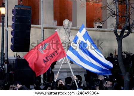 Athens, Greece Jan. 25, 2015.Supporters of Syriza left wing party with Greek blue flag and Syriza`s red outside Athens University. Syriza, won Sunday\'s general election.