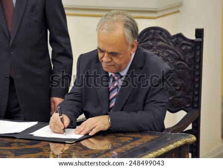 Greece, Athens, Jan. 27, 2015. Greece\'s Deputy Prime Minister Giannis Dragasakis signs a protocol after the swearing in ceremony at the Presidential Palace.