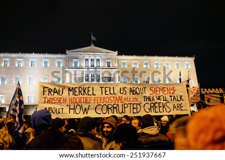 Athens Greece February 11, 2015 Protesters with signs during an anti-austerity, pro-government demonstration outside the Greek parliament on the eve of a crucial euro zone finance ministers meeting.