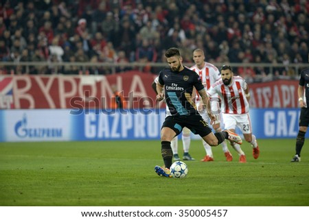 Piraeus, Greece Dec. 09, 2015. Olivier Giroud of Arsenal scores a goal to make the score 0-3 during the UEFA Champions League match between Olympiakos and Arsenal United.