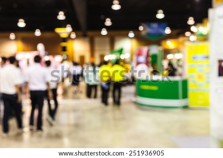 Abstract people walking in exhibition blurred background