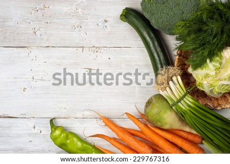 Vegetables right frame on the white wooden table horizontal