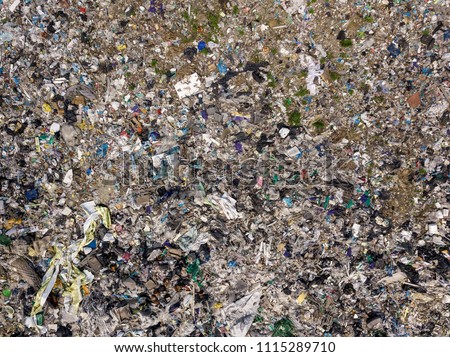 Environmental pollution. Aerial top view photo from flying drone of large garbage pile. Garbage pile in trash dump or landfill
