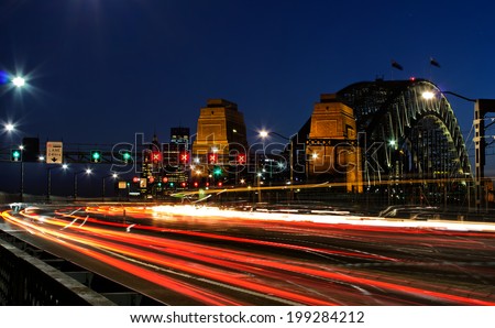Commuter traffic travels over Sydney Harbour Bridge in the evening rush hour