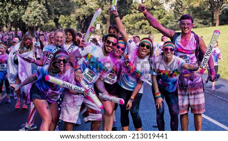SYDNEY,AUSTRALIA - AUGUST 24,2014: Competitors in the \'Color Run\' fun run in Centennial Park. Runners are doused in coloured powder, bubbles and water as they run the 5K course.