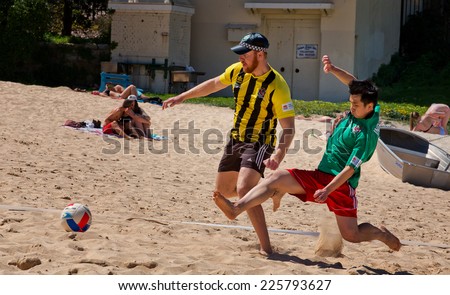 COOGEE,AUSTRALIA - SEPTEMBER 28,2014: An annual beach soccer tournament between police and international students. The aim is to build trust and encourage dialogue.