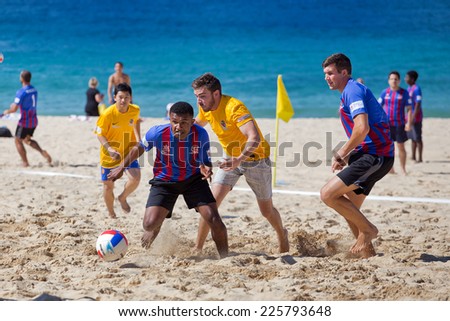 COOGEE,AUSTRALIA - SEPTEMBER 28,2014: An annual beach soccer tournament between police and international students. The aim is to build trust and encourage dialogue.
