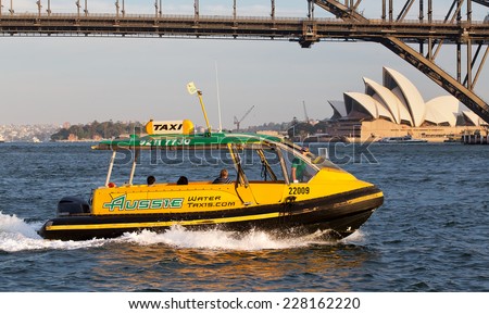 SYDNEY,AUSTRALIA - OCTOBER 31,2014: A water taxi crosses Sydney Harbour. Available pre-booked or on-the-fly, water taxis are a flexible but expensive alternative to ferries in Sydney.