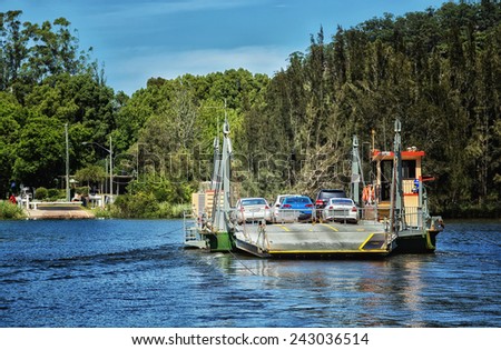 WISEMANS FERRY, AUSTRALIA - JANUARY 4,2015: Vehicles are carried across the Hawkesbury River by cable ferry. Open since 1829, the free service runs on demand 24/7.