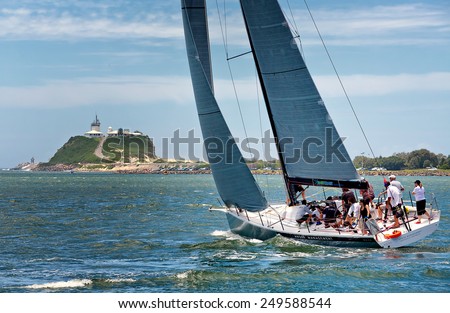 NEWCASTLE,AUSTRALIA - JANUARY 24,2015: Members of a local sailing club race their boat on the harbour. Newcastle is the 2nd city of New South Wales, after Sydney.