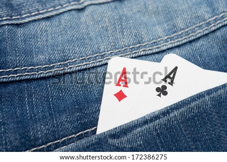 pair of aces in a jeans pocket