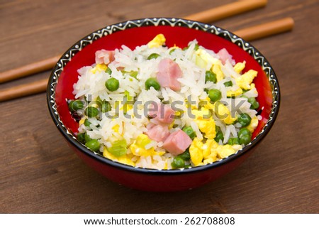 Cantonese rice on wooden table seen close