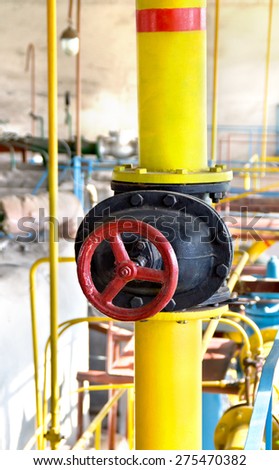 Yellow gas pipe and red valve