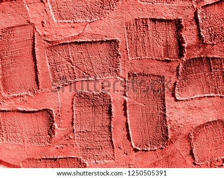 Trend photography on the theme of the actual colors for this season - a shade of orange. Real texture of plaster background with areas of rectangular depressions.