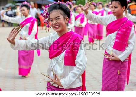 CHIANG-MAI, THAILAND - OCT 26: Thailand Festival for donating money to the temple for publishing Buddhism.The girls dance to worship on October 26, 2013 at Chang-mai province Thailand.