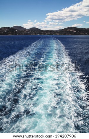 Mediterranean Sea  background.Clear dark blue water.Trail of ferry.Greece.Port Ayia Marina.