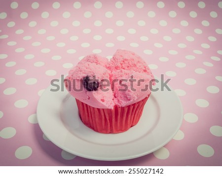 Pink Chinese steamed cup cake on pink polka dot floor with vintage filter effect