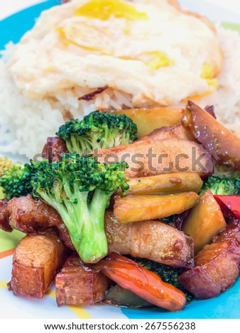Pork stir-fried broccoli and chili with fried egg, Thai food